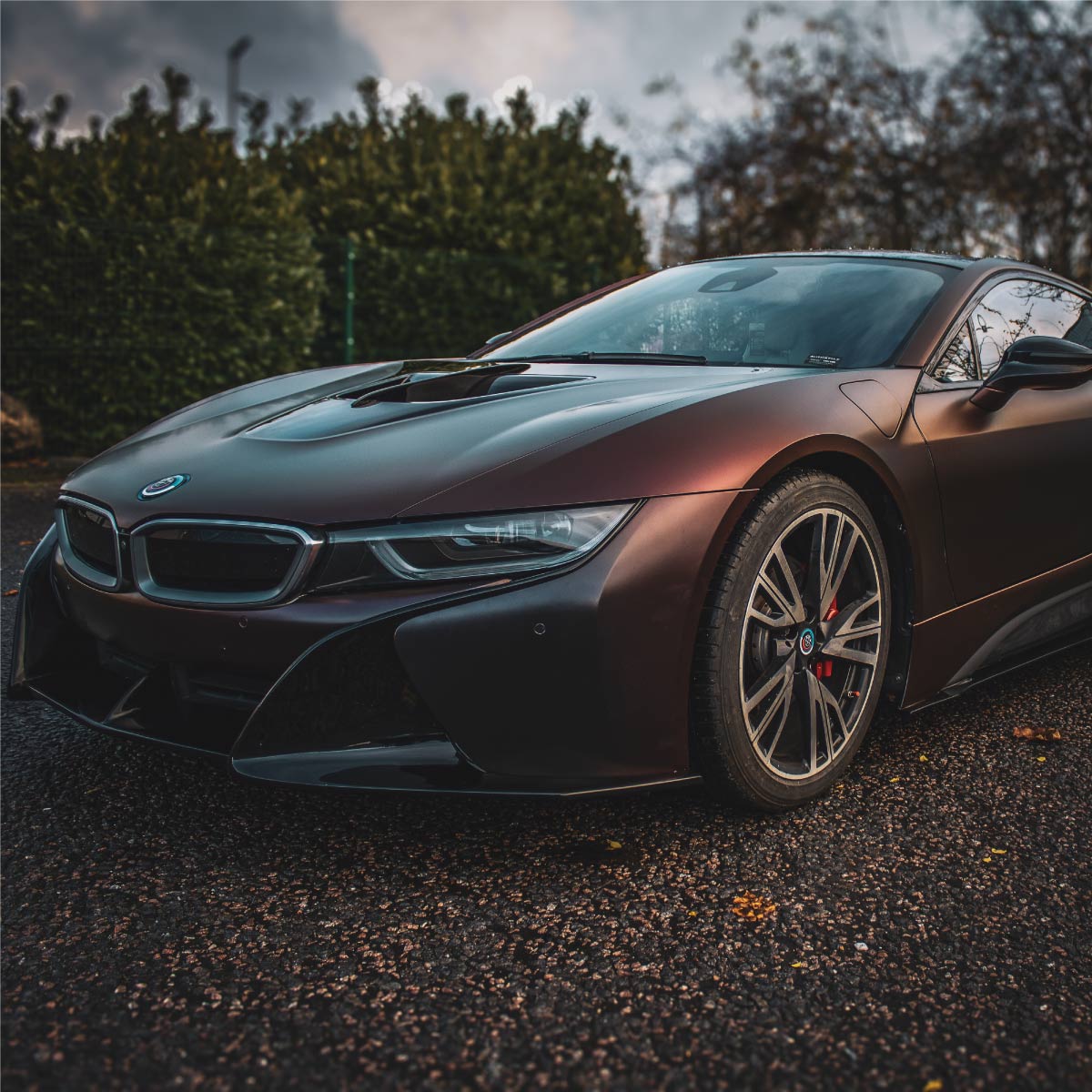 a BMW i8 fully wrapped in a deep colour flip vinyl